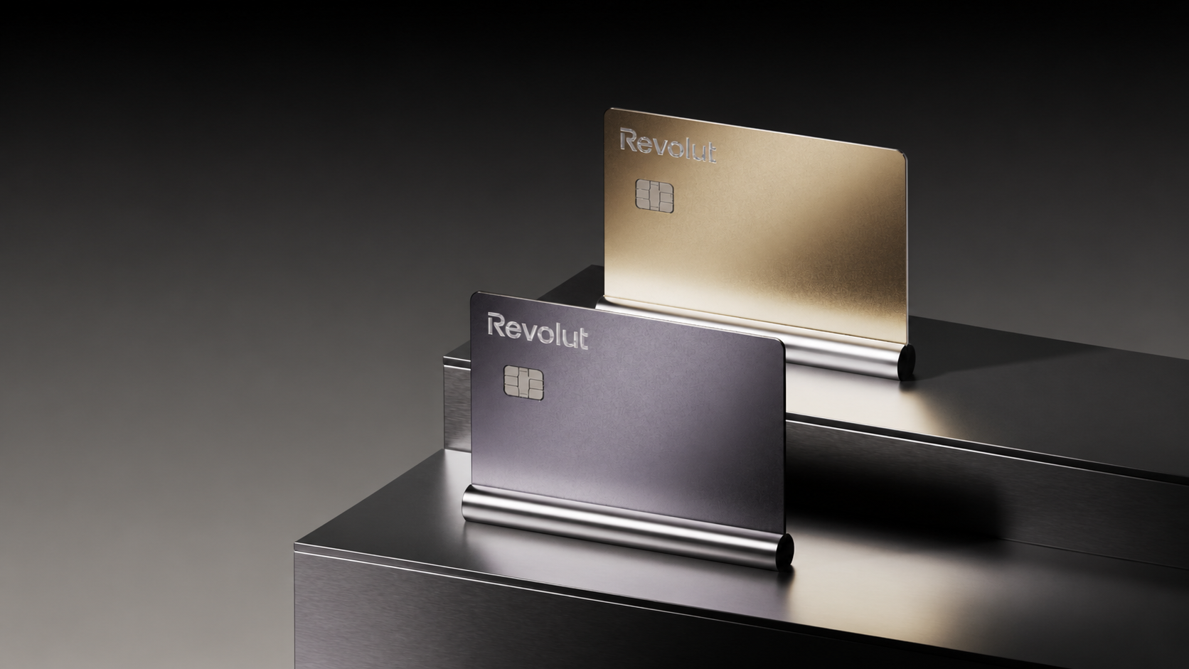 Revolut Metal cards displayed on dark metallic plinths