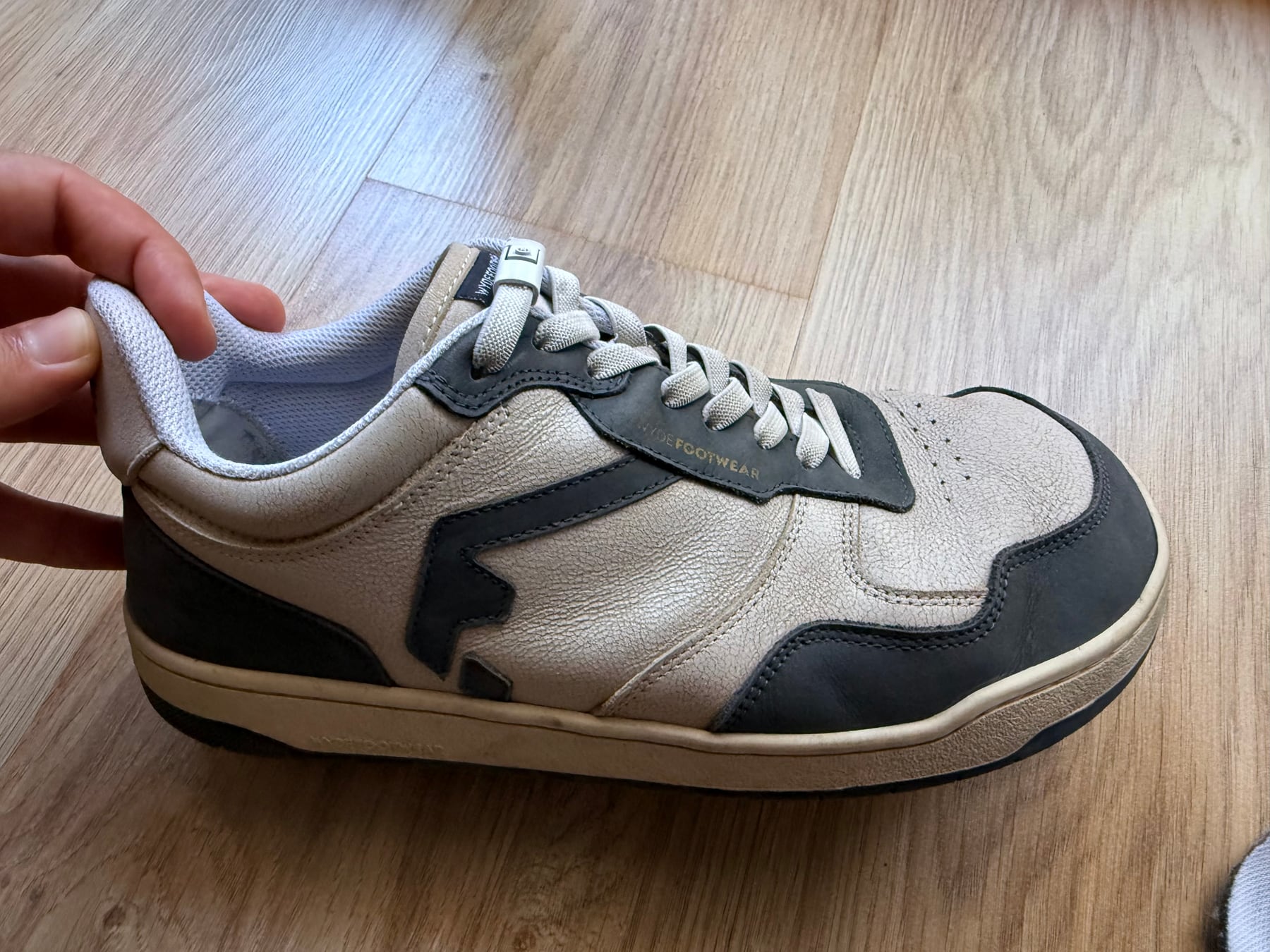 Side profile of a WYDE Nova sneaker showing leather creases after ten months